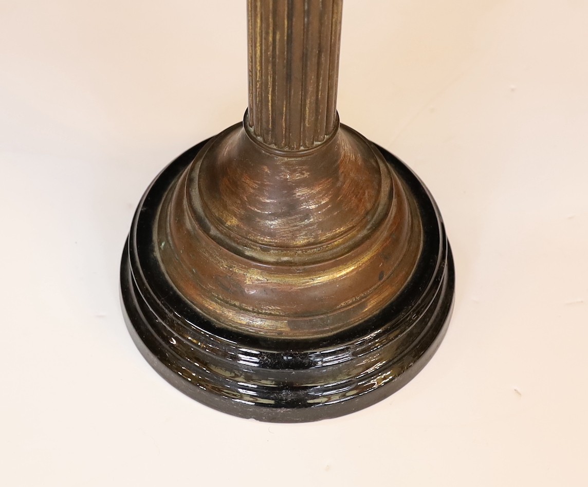 A late Victorian brass and opaque pink glass oil lamp, with Burnes duplex mechanism, pink tinted etched glass globe and flue, height overall 71cm